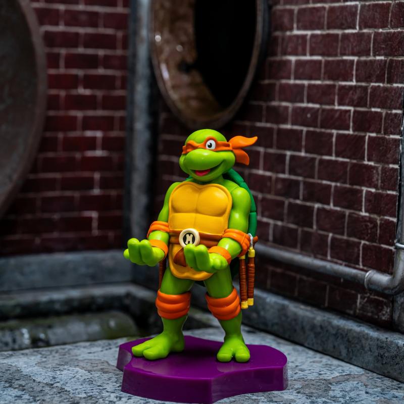 TMNT: Michaelangelo Cable Guys Holdem - Earbud Holder (11 cm) / Stojak na słuchawki Wojownicze Żółwie Ninja - Michaelangelo (11 cm)